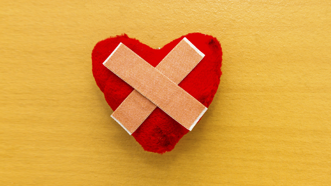 Heart pillow with bandaids